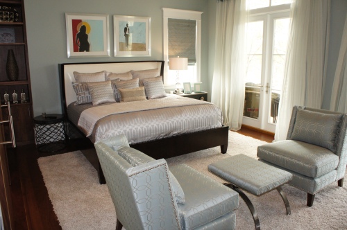 This Guest Bedroom is furnished with a modern King wing bed by Hickory White, a coordinating nightstand, and small round table.  The plush shag area rug anchors the room and provides a soft cushion for the toes!