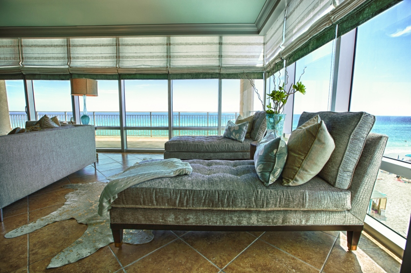 Two Century chaise lounges add some "swag" to this sitting area.  Plush gray croc chenille fabric adds some richness against the blue and white backdrop of the ocean!