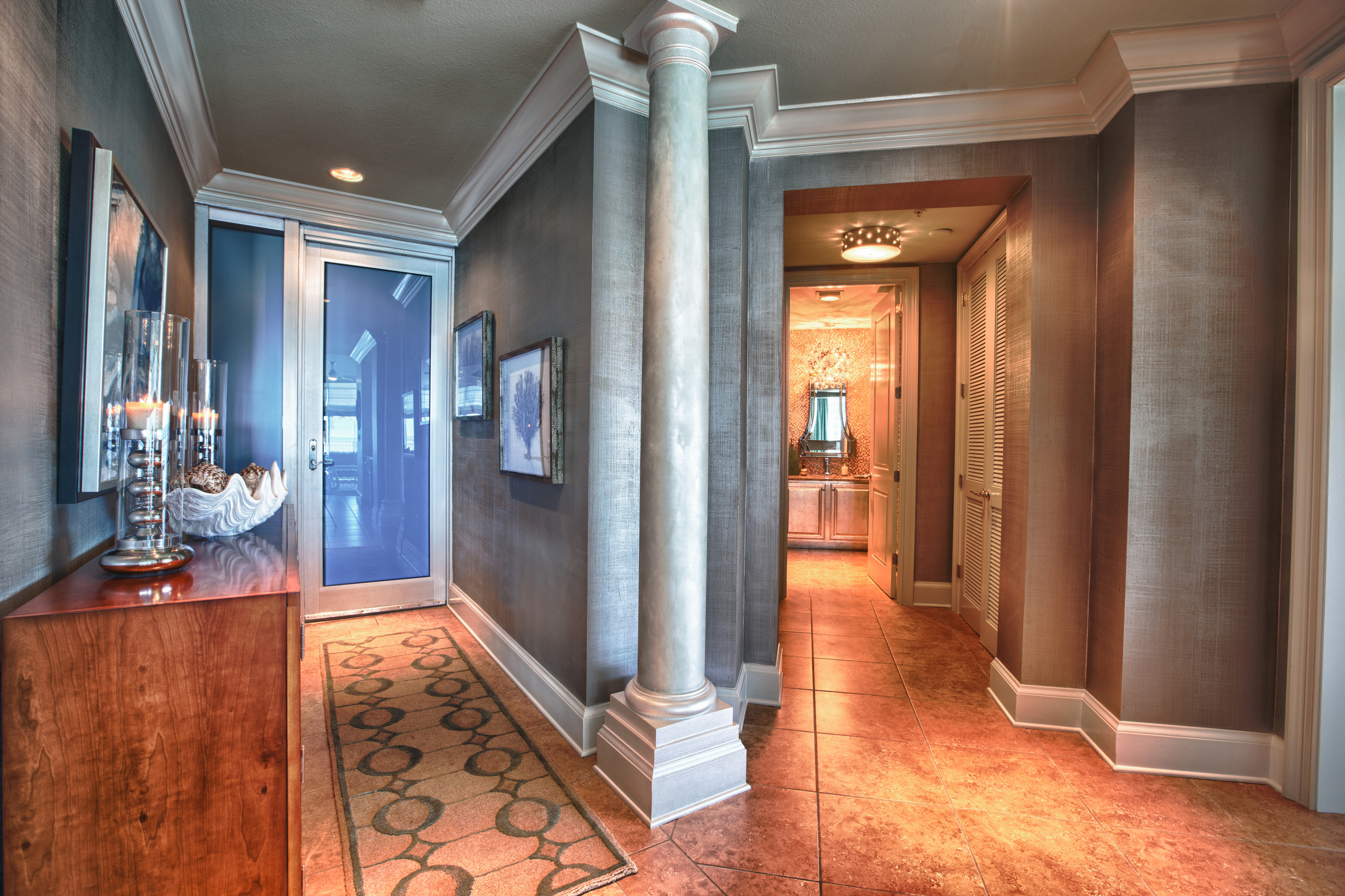 This shot allows you to see the Entry and Powder Bath entrance.  The walls here are a silver linen textured faux finish, and the columns were given a pearlescent finish.  